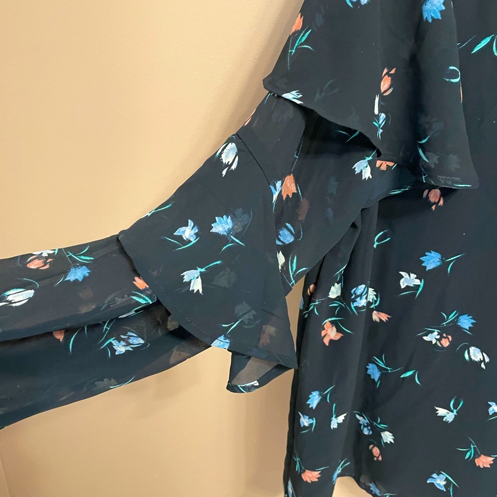 Long-sleeve navy ruffled-sleeved blouse